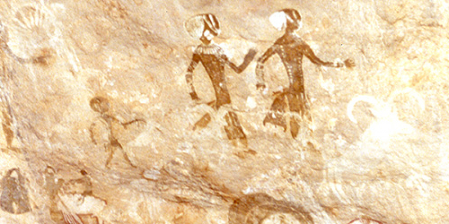 Algeria: Neolithic rock painting depicting human figures and a magnificent mouflon head