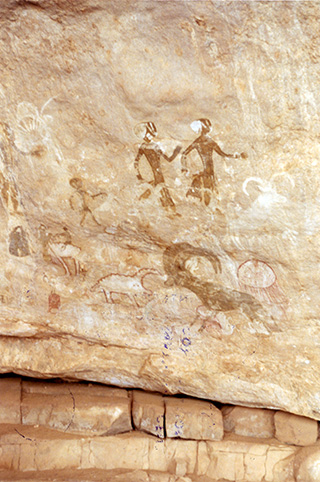 Algeria: Neolithic rock painting depicting human figures 