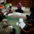 RE-ORG team from Museum Manusia at the Sangiran Early Man Site in Indonesia discuss implementing their project in the storage room